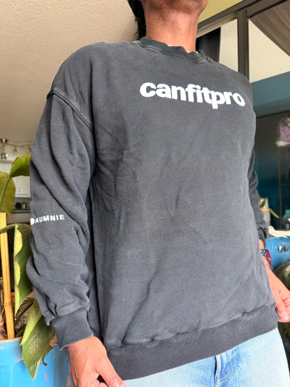 Distressed black CANFITPRO branded sweatshirt